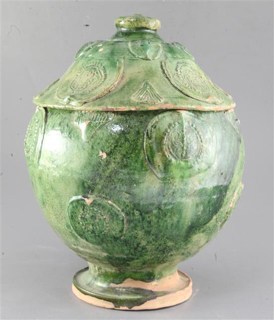 A Chinese green glazed pottery jar and cover, Yuan dynasty (1271-1368), height 34.5cm